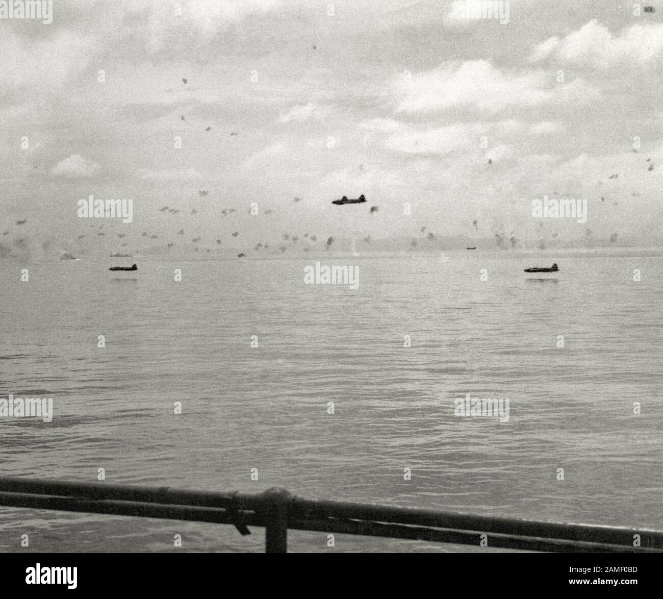 The Japanese Mitsubishi G4M torpedo bombers on a low-level flight during the second attack on the American ships from the sea convoy in Operation Watc Stock Photo