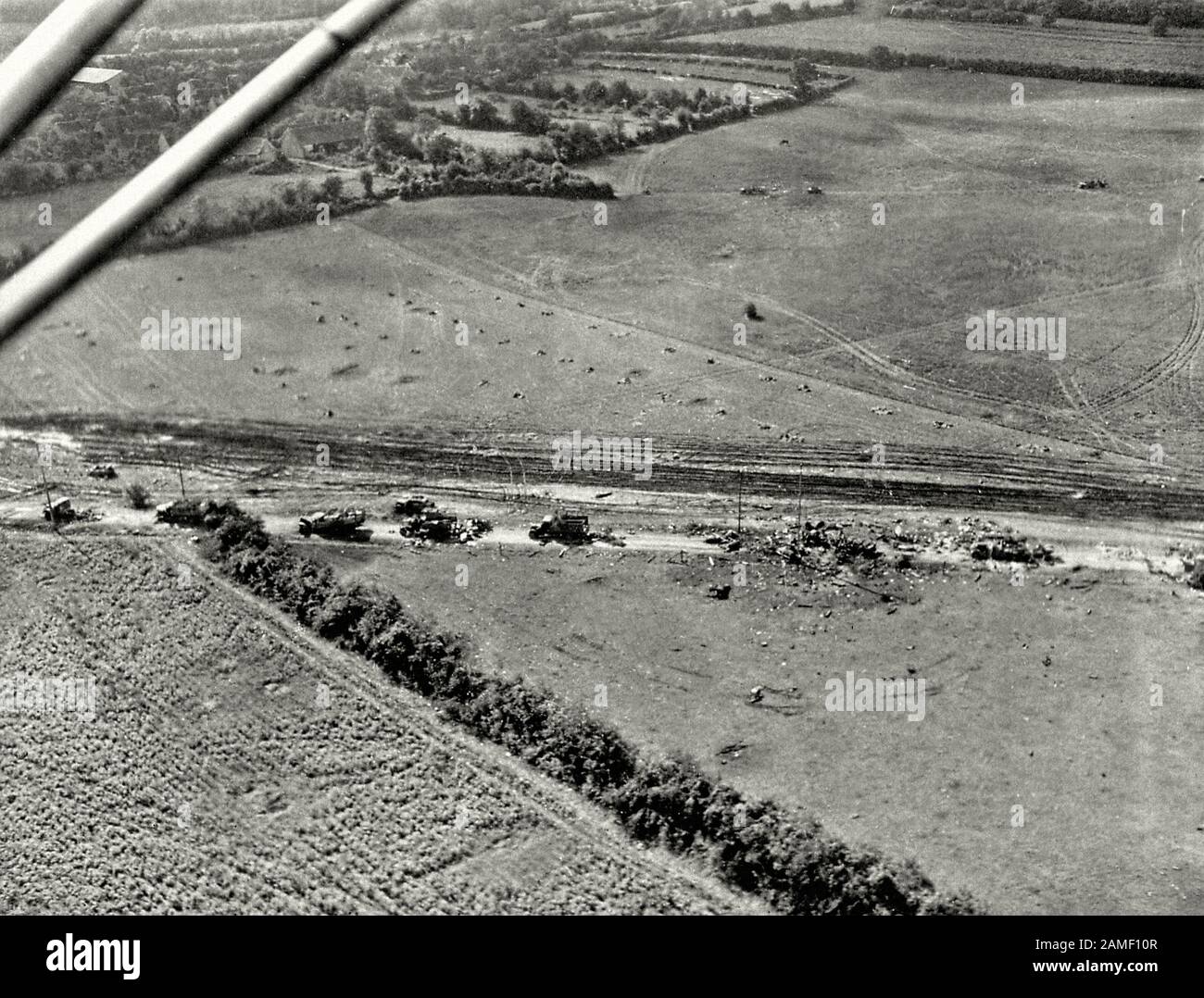 Battle of France in the Second World War: Photo of a German military road convoy destroyed by aerial allied aircraft near Nonant-le-Pin in Normandy. F Stock Photo