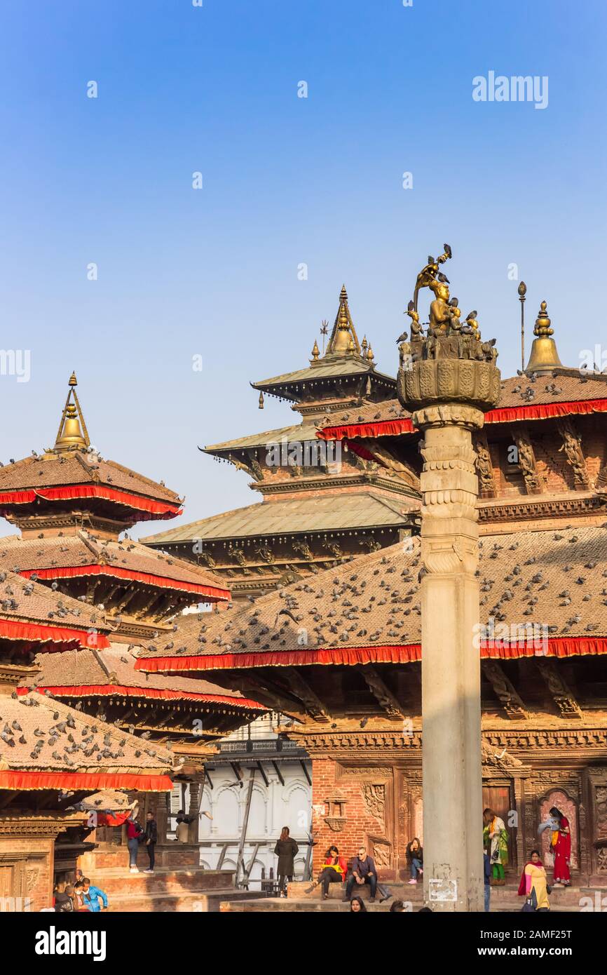 Pillar in front of temples at Durbar square in Kathmandu, Nepal Stock Photo