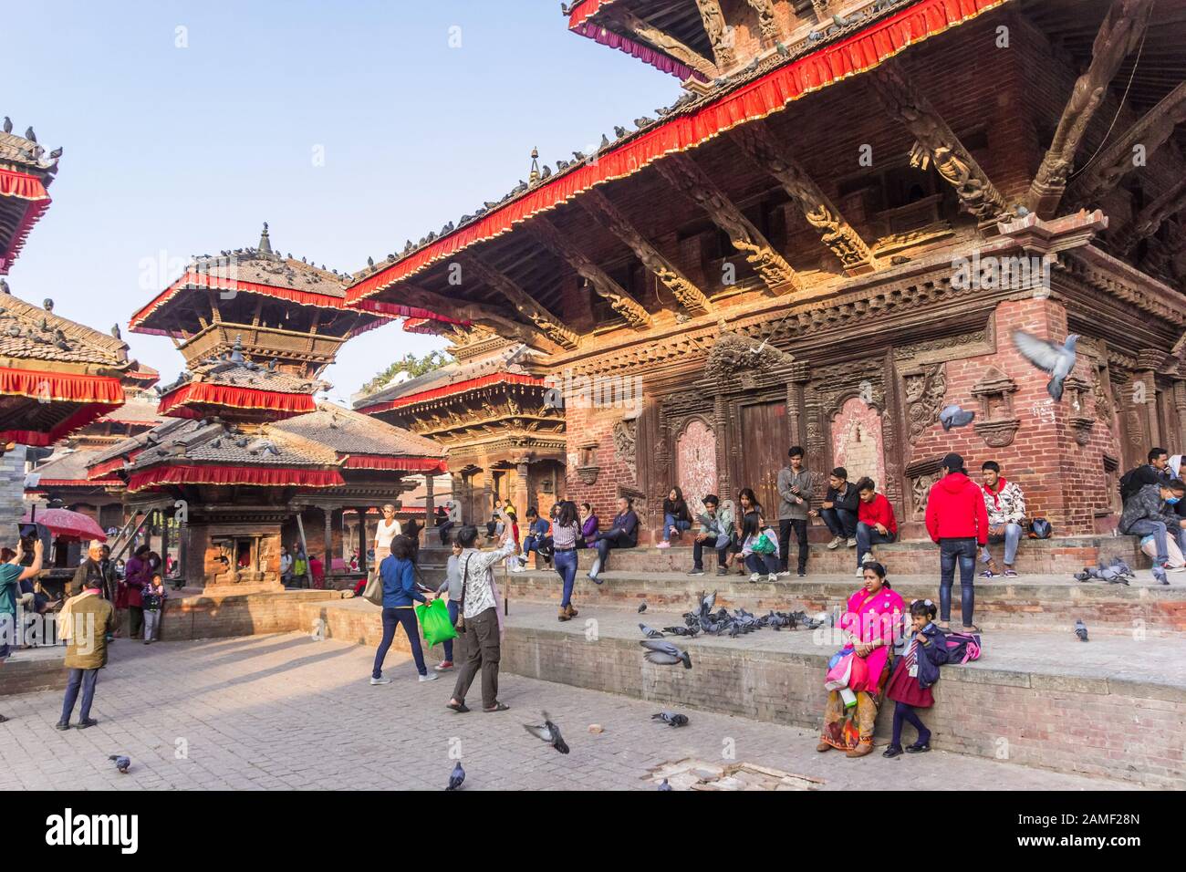 People, temples and dovs at Durbar square in Kathmandu, Nepal Stock Photo