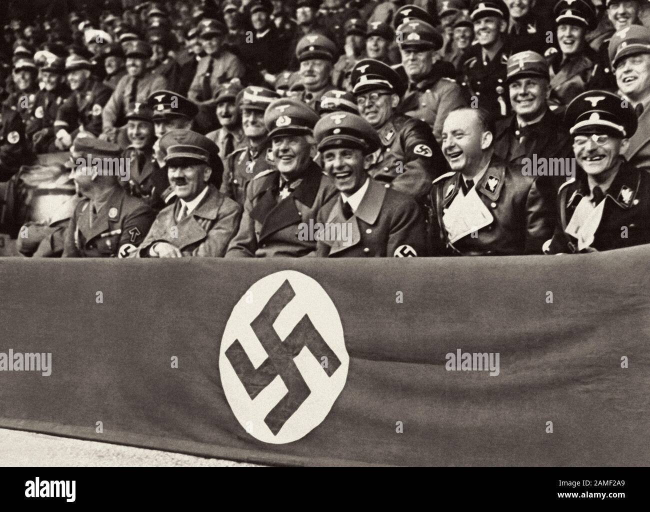 Adolf Hitler surrounded by Joseph Goebbels, Werner von Blomberg, Viktor Lutze, Dr. Dietrich and Fiehler attended a laughing competition at the stadium Stock Photo