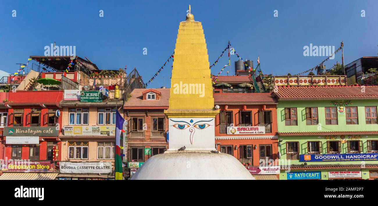 Panorama of the Boudhanath stupa in front of colorful houses in
