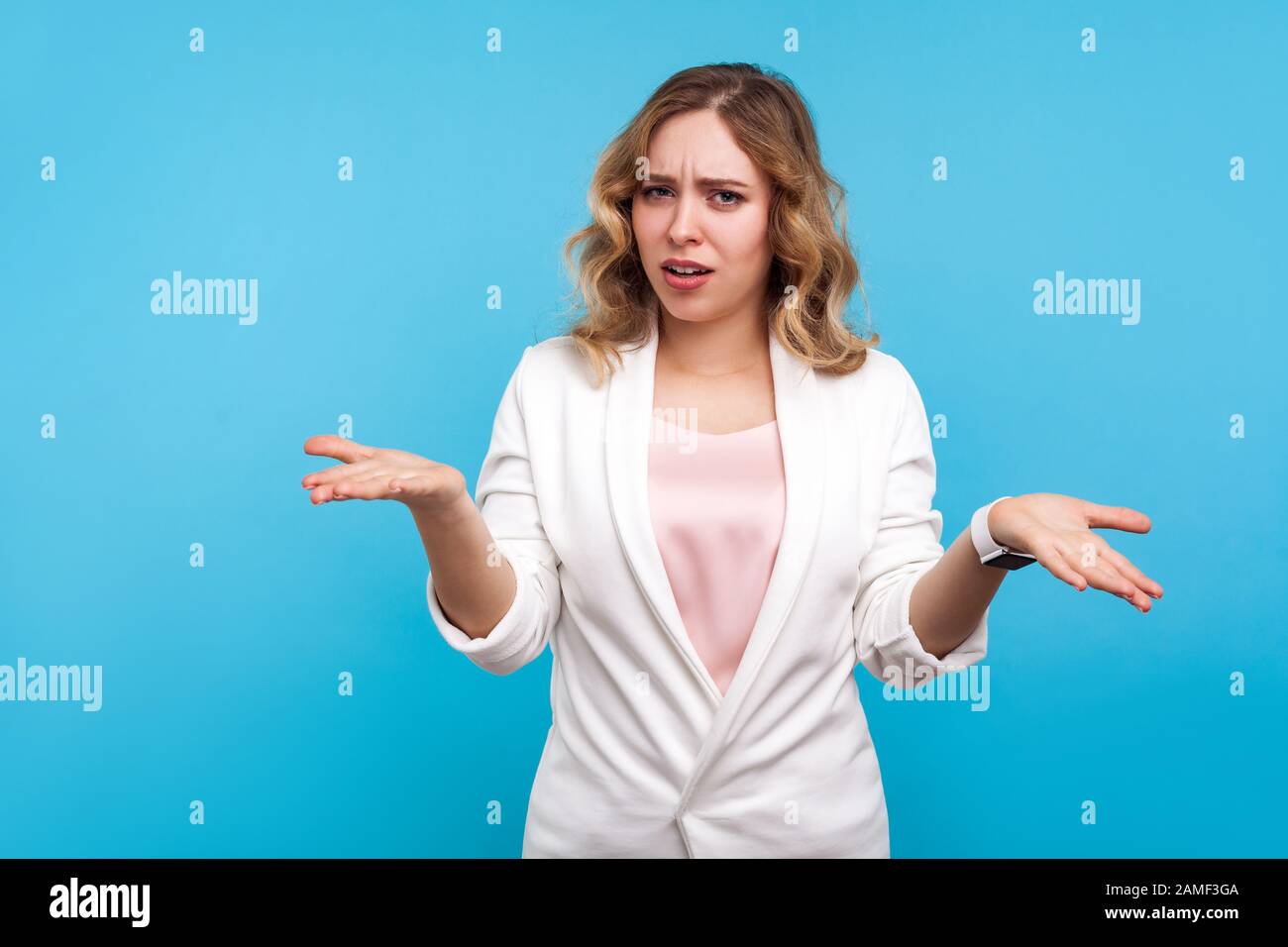 What Do You Want Portrait Of Confused Woman With Wavy Hair In