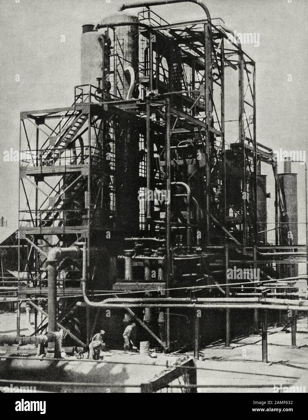 The life in Soviet Union in 1930s. From soviet propaganda book. Photo: Mounting the soviet tubular in Baku. The young oil machine-building industries Stock Photo