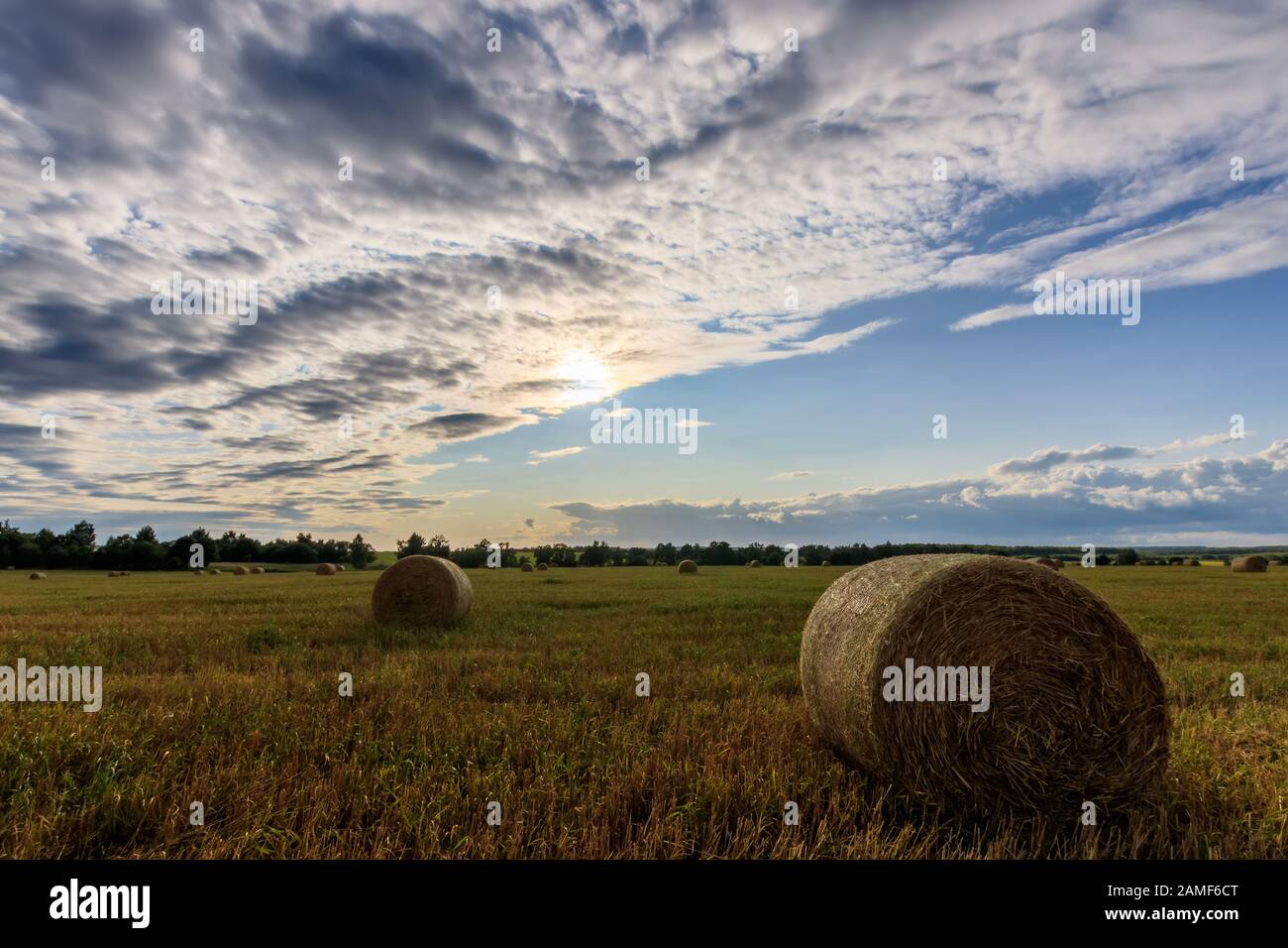 Haystacks on the field in Autumn season. Rural landscape with cloudy ...