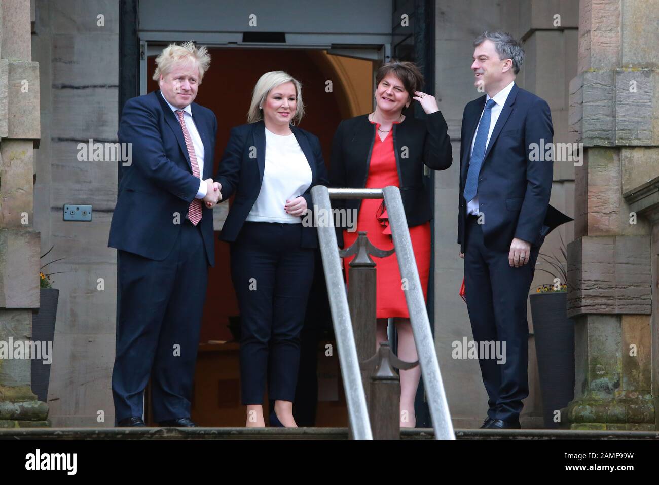 Belfast, Northern Ireland. 13th Jan 2020. British Prime Minister Boris Johnston (left) and Secretary of State for Northern Ireland Julian Smith (right) is greeted by the new Deputy First Minister Michelle O'Neill and First Minister Arlene Foster at Stormont Castle, Belfast, Northern Ireland on Jan 13, 2020. Prime Minister Boris Johnson has arrived at Stormont to mark the restoration of devolution in Northern Ireland. Taoiseach (Irish prime minister) Leo Varadkar is due later on Monday. Credit: Irish Eye/Alamy Live News Stock Photo