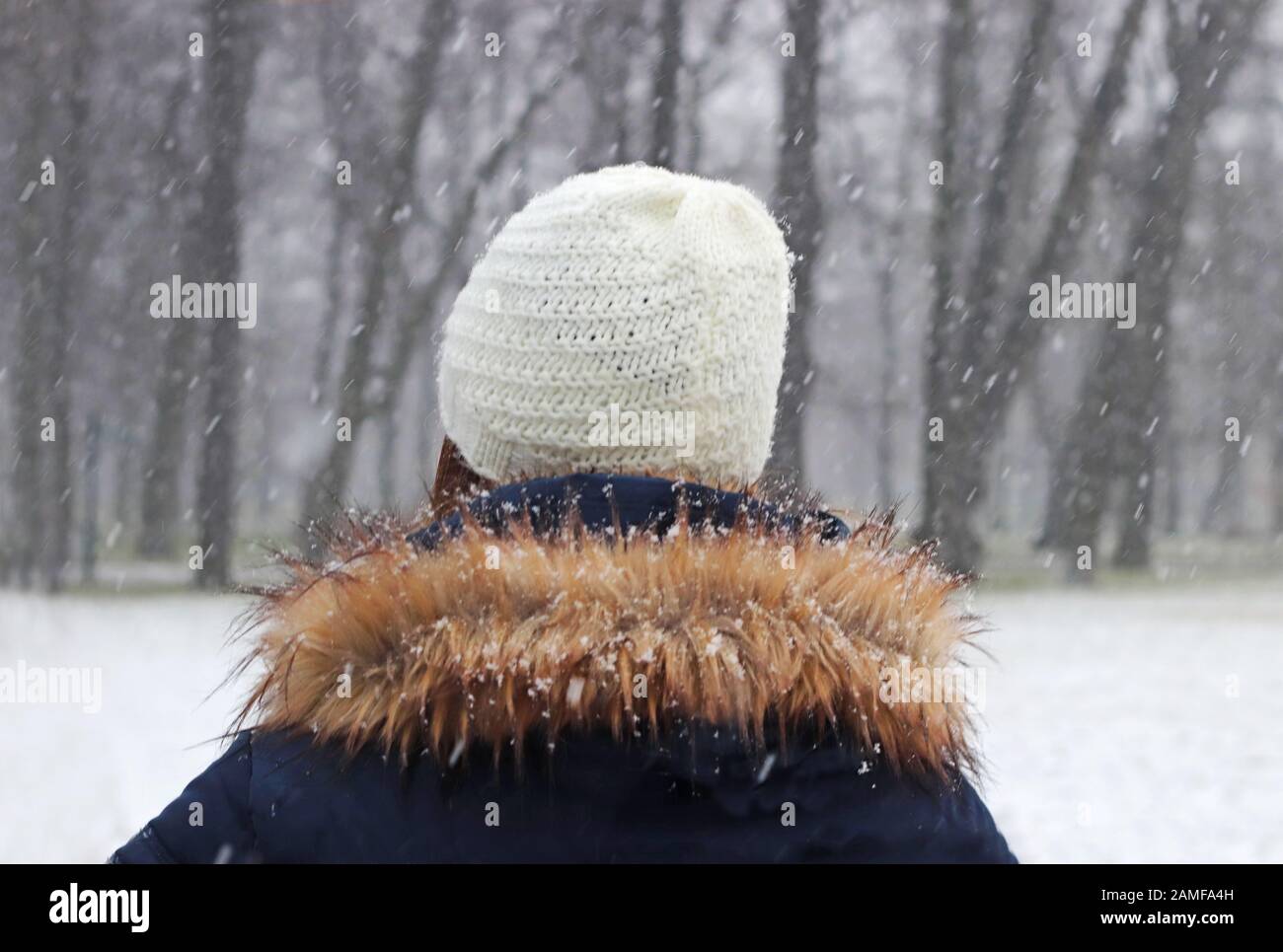 Woman parka snow rear view hi-res stock photography and images - Alamy