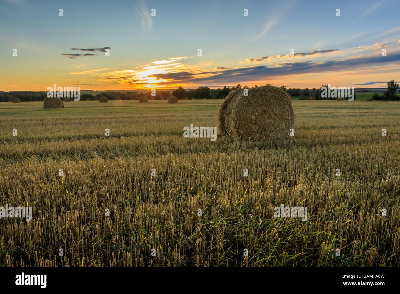 Haystacks on the field in Autumn season. Rural landscape with cloudy ...