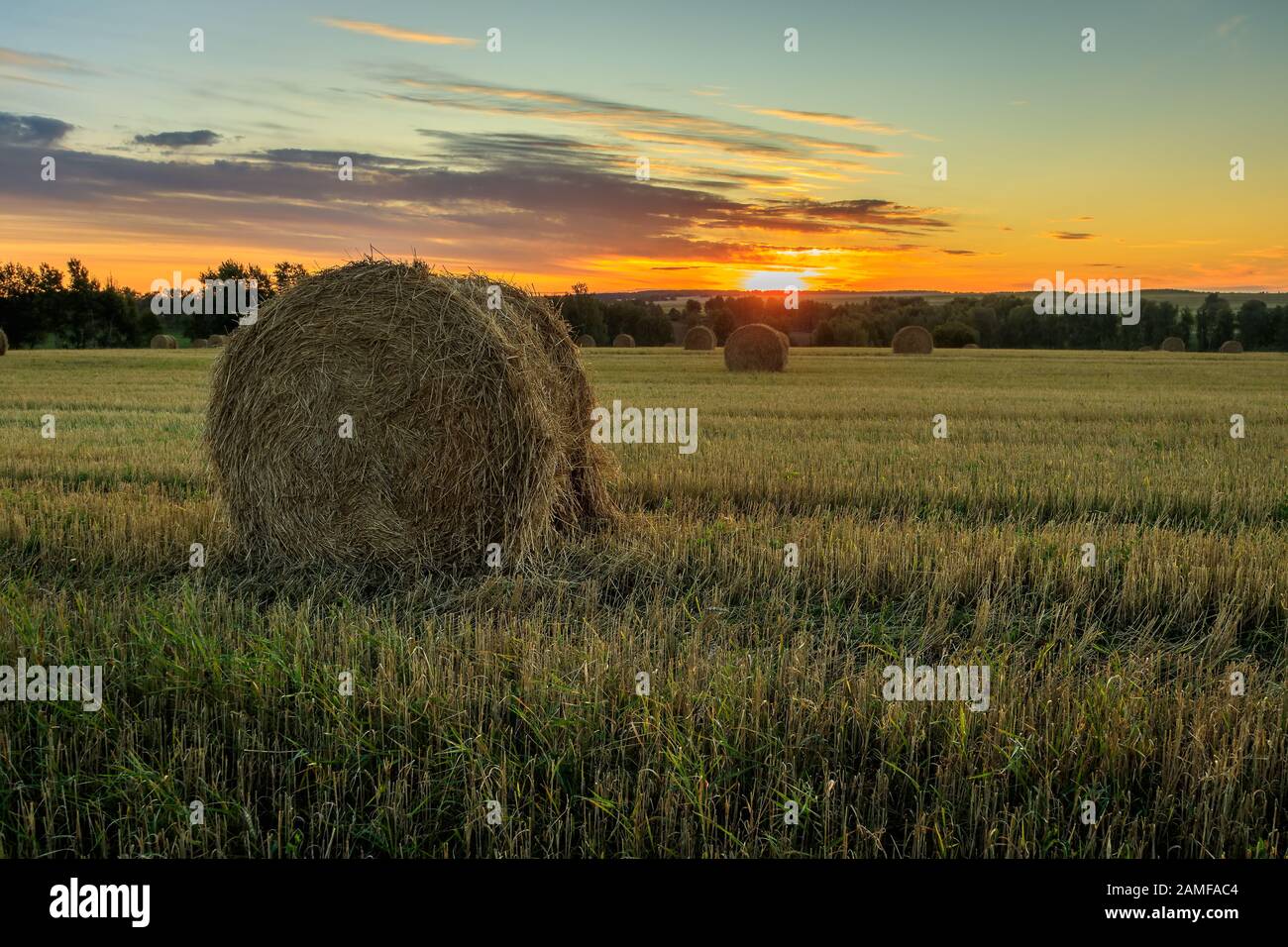 Haystacks on the field in Autumn season. Rural landscape with cloudy ...