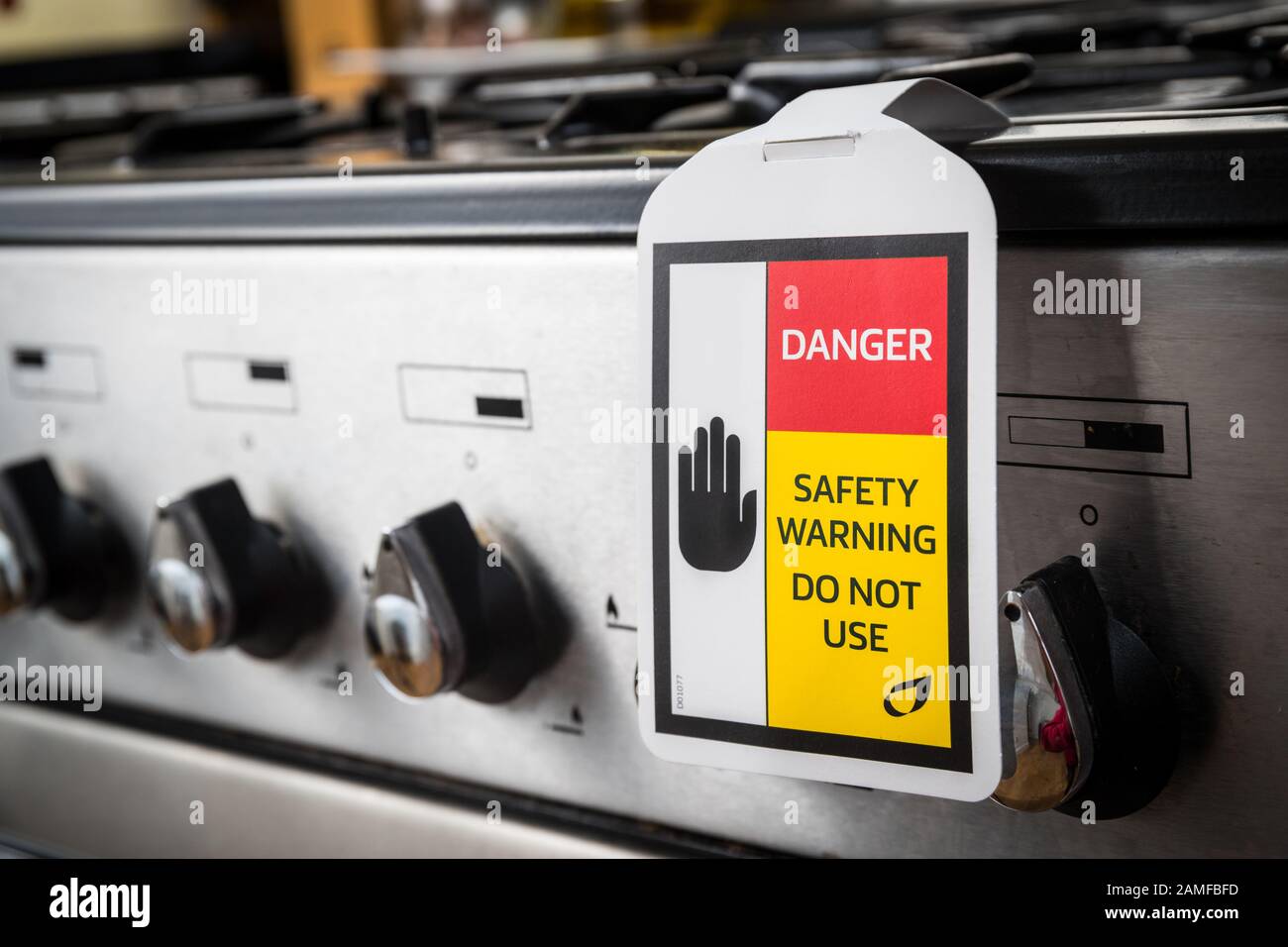 Gas safety warning sign on a faulty gas cooker Stock Photo