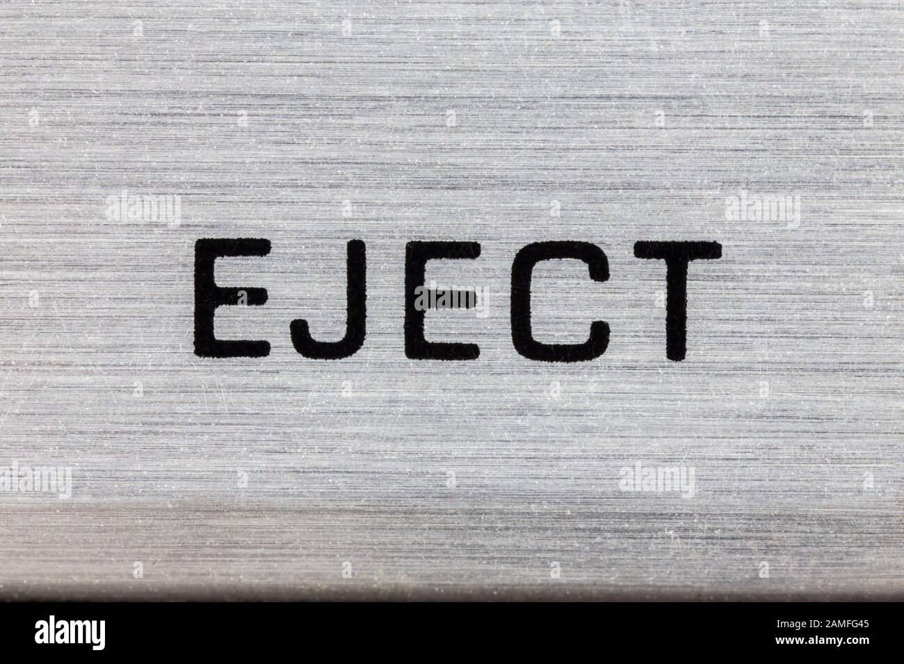 Macro close up photograph of vintage tape machine eject button detail. Stock Photo