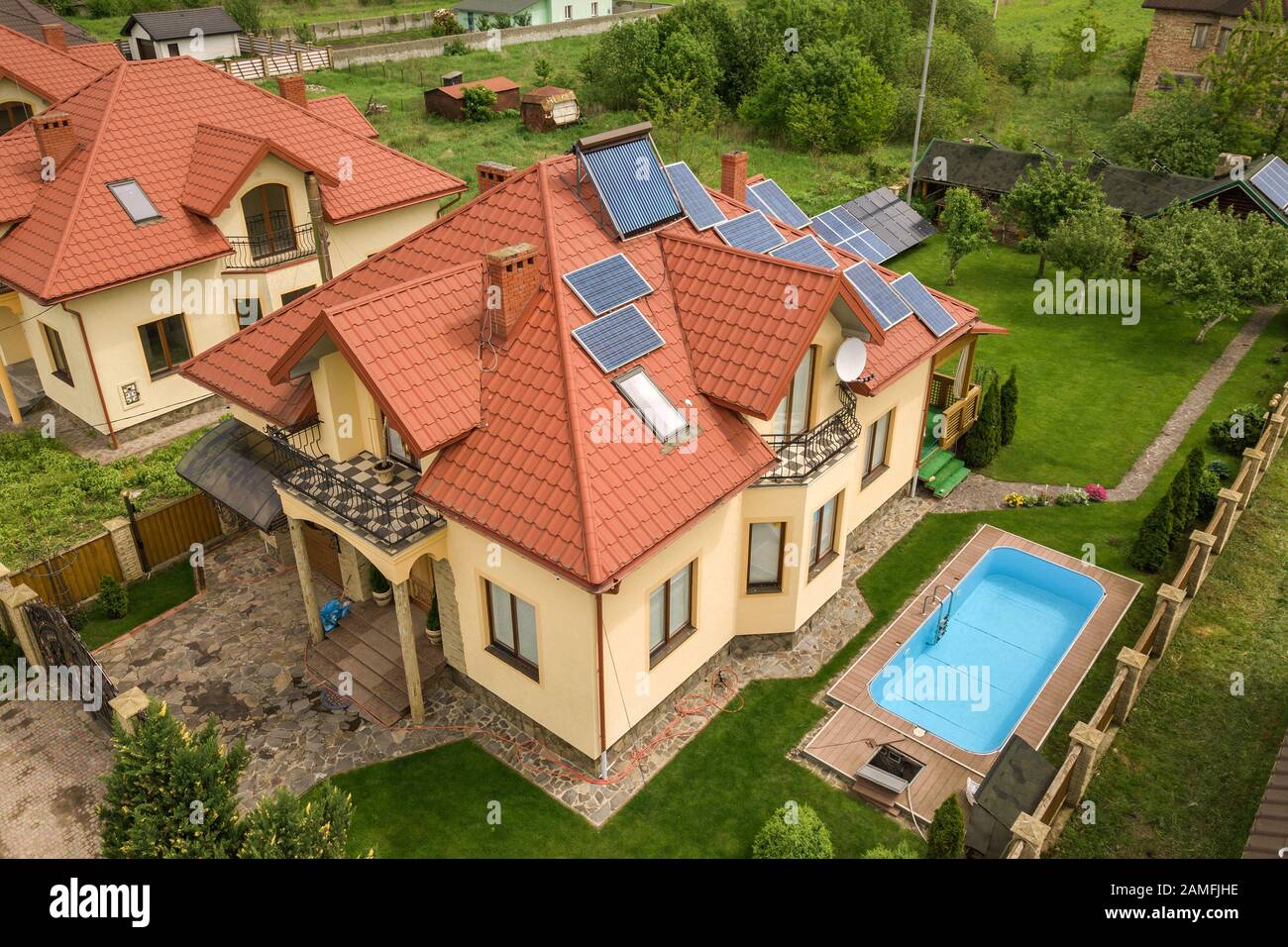 Aerial view of a new autonomous house with solar panels and water ...