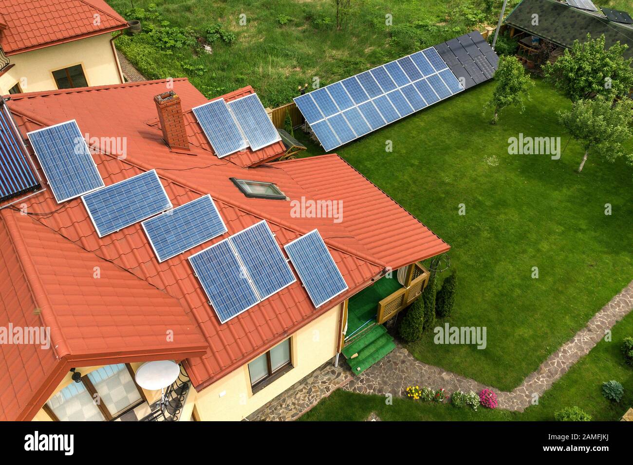 Aerial view of a new autonomous house with solar panels and water ...