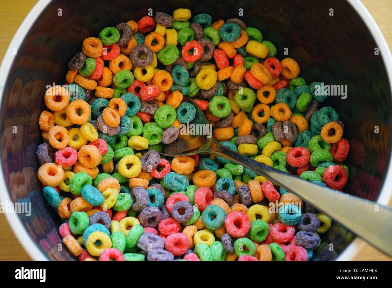 Bowl of colorful fruit loops cereal Stock Photo Alamy