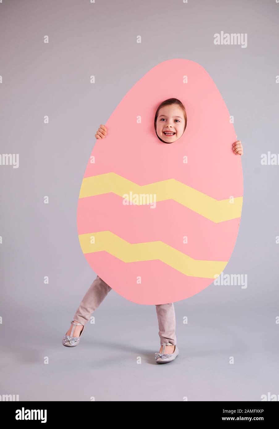 Portrait of happy girl in easter costume Stock Photo