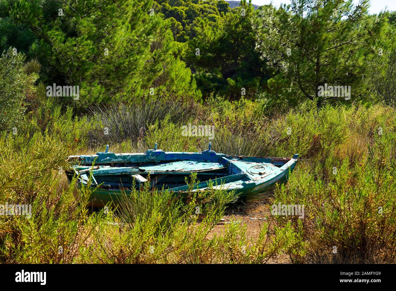 A deserted rowing boat on land Photographed on the Greek Island of Cephalonia, Ionian Sea, Greece Stock Photo