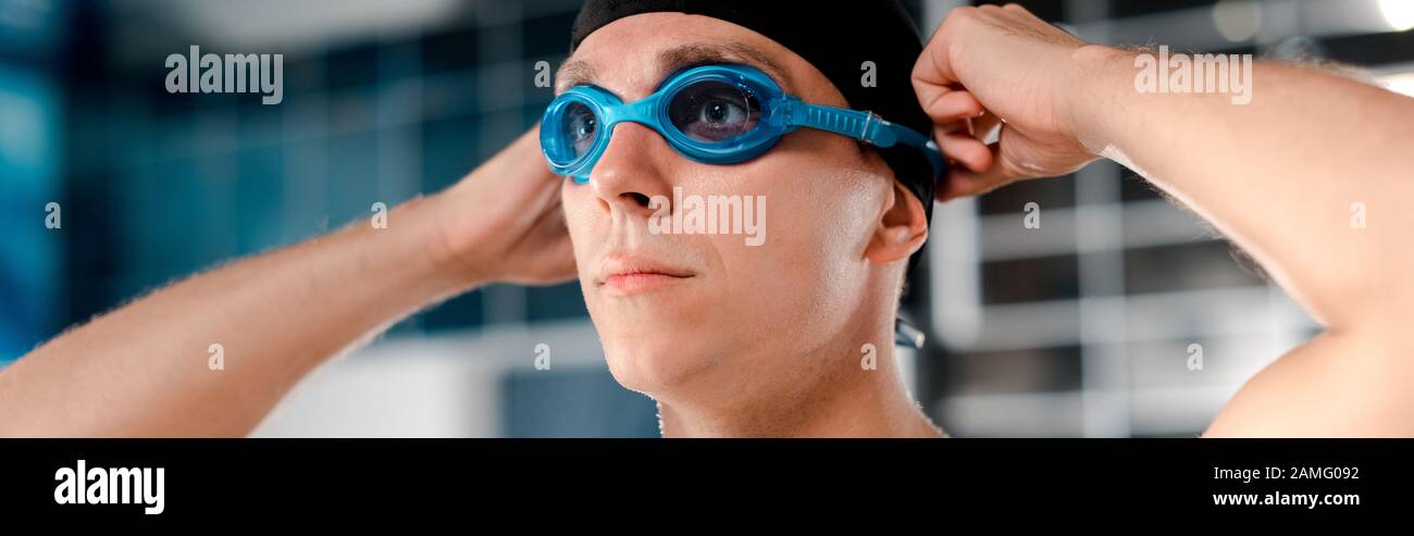 panoramic shot of swimmer wearing goggles Stock Photo