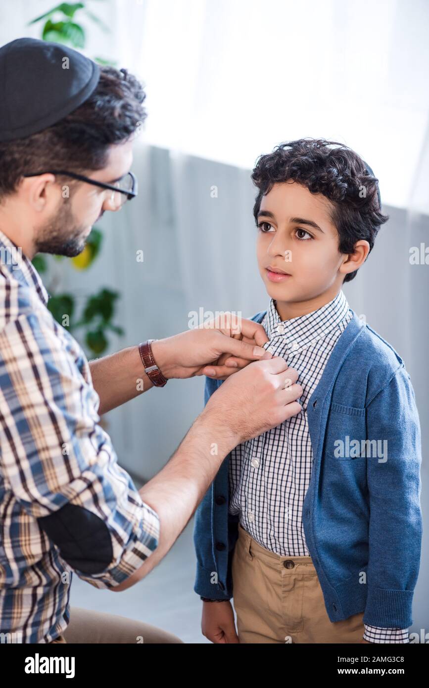 Man Buttoning Her Son Shirt Hi res Stock Photography And Images Alamy