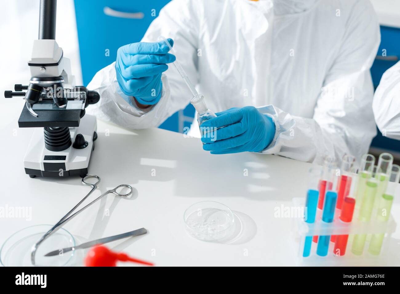 cropped view of scientist doing dna test in lab Stock Photo