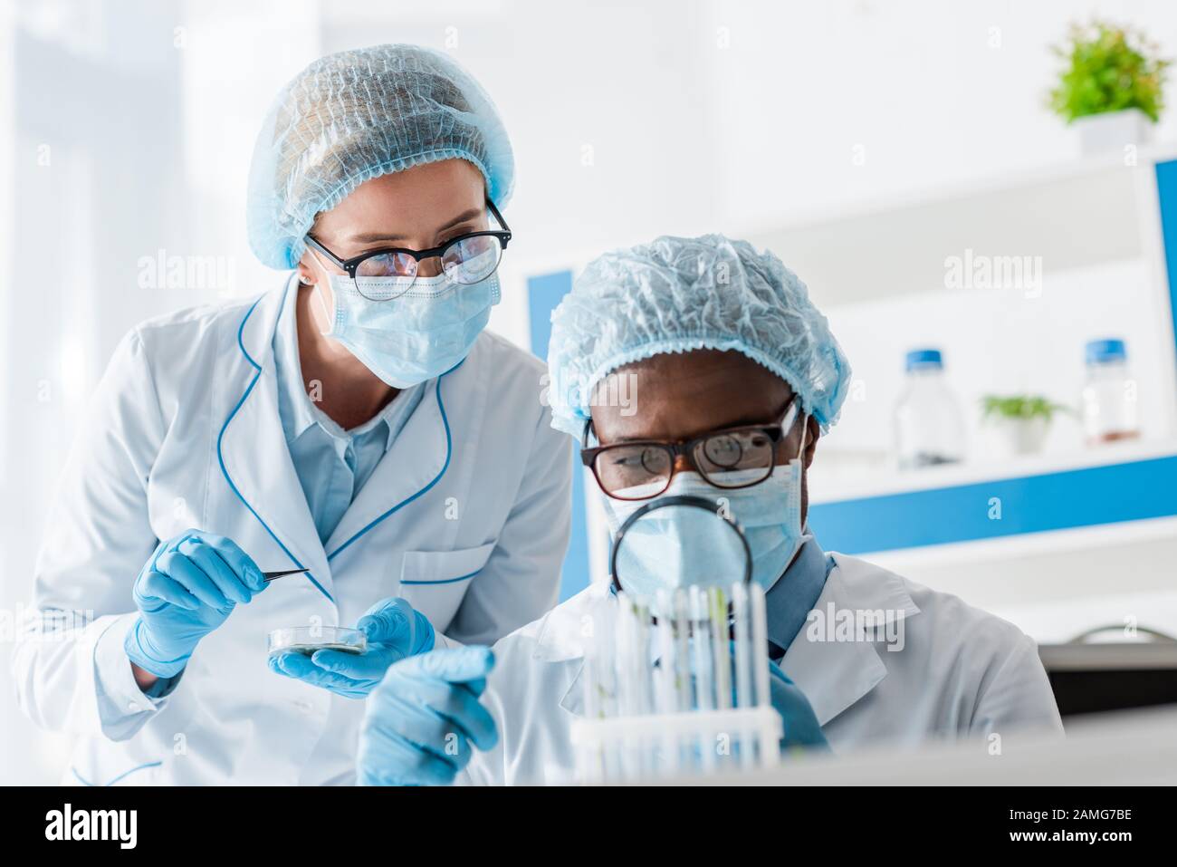 Two scientists looking glass hi-res stock photography and images - Alamy