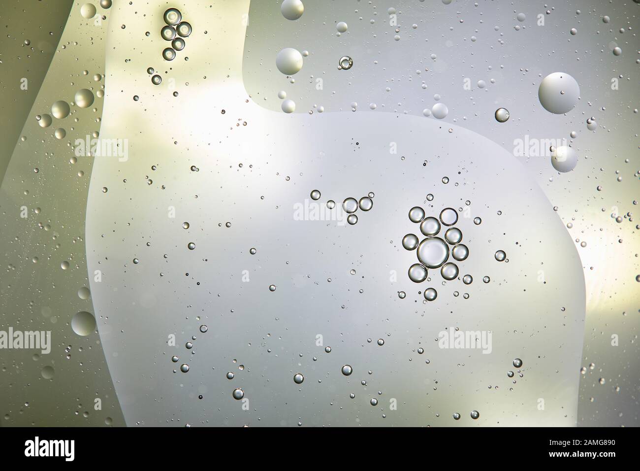 Beautiful background from mixed water and oil bubbles in light