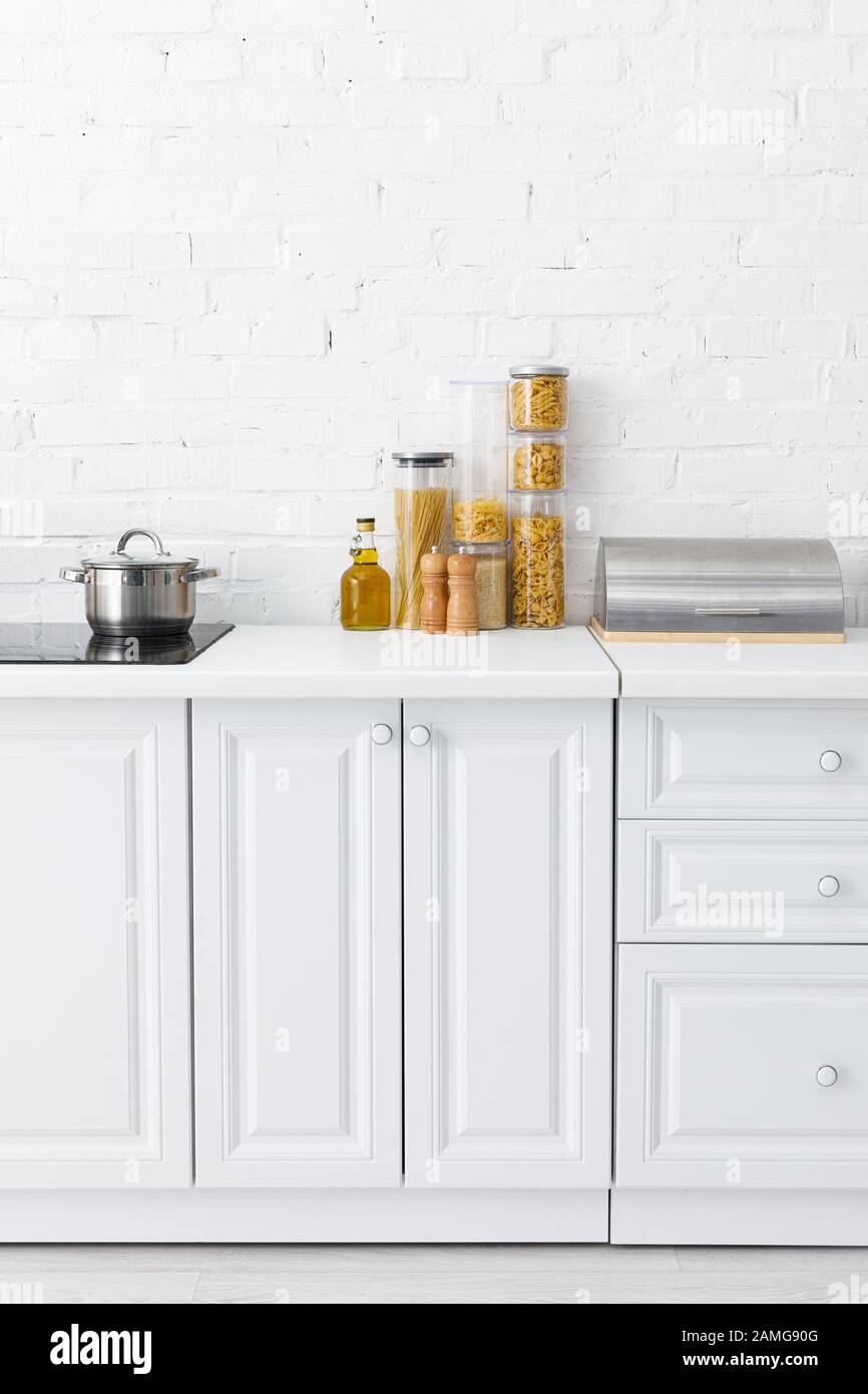 Minimalistic Modern White Kitchen Interior With Induction Cooktop