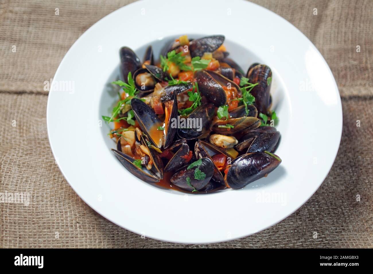 Fresh blue mussels in white wine brew Stock Photo