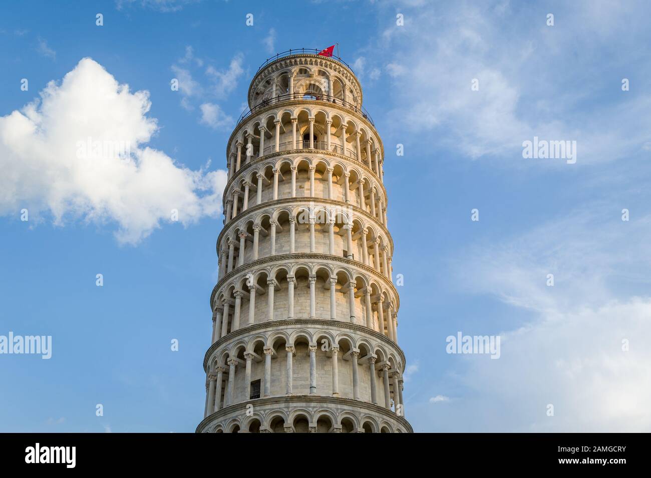 Pisa tower close view and light clouds at blue sky. Pisa, Italy. Stock Photo