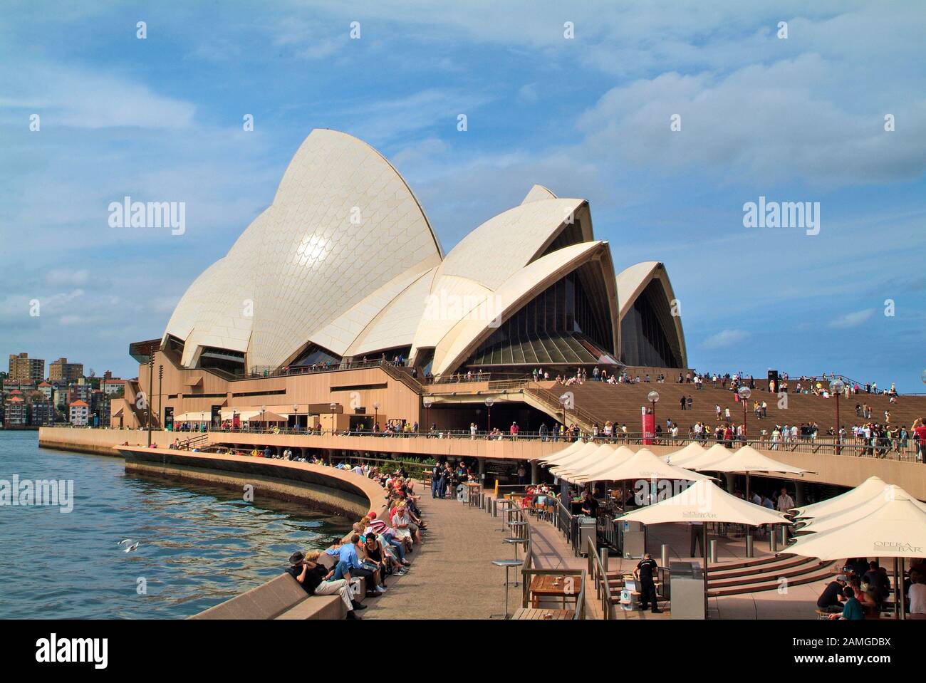 Sydney, Australia - February 08, 2008: Unidentified people on Circular Quay with restaurants and cafe's and impressive Sydney Opera building, a prefer Stock Photo