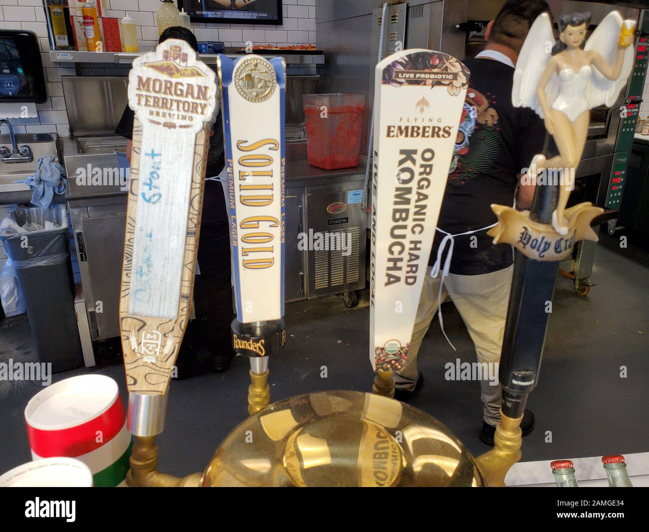Close-up of beer taps with several craft beers, as well as hard kombucha, Walnut Creek, California, November 8, 2019. The fermented drink is popular in the San Francisco Bay Area, and is believed to have health enhancing qualities. () Stock Photo