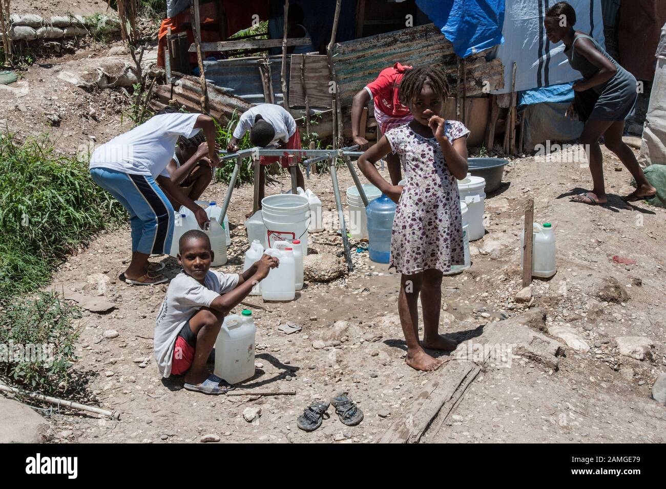 Child water haiti hi-res stock photography and images - Alamy