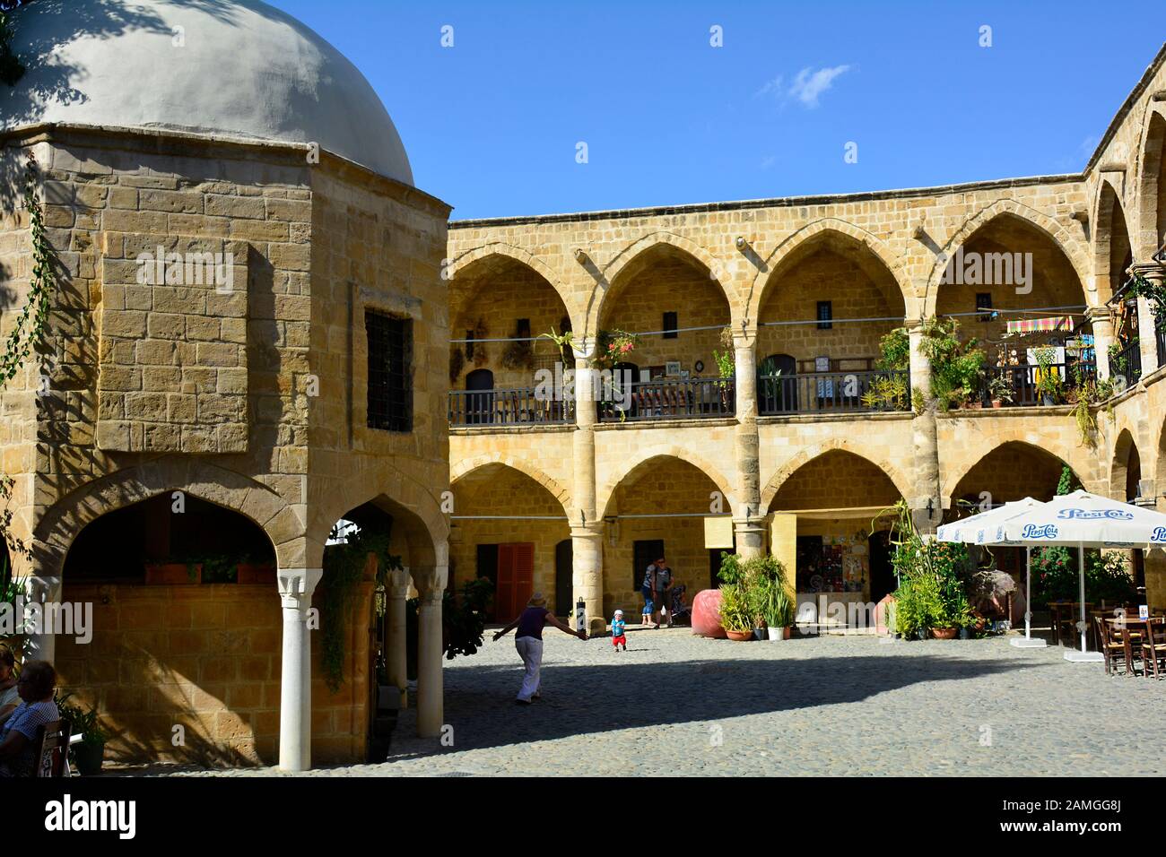 Nicosia, Cyprus - October 20th 2015: Unidentified people, shops and restaurant inside the Great Khan aka Buyuk Han building Stock Photo