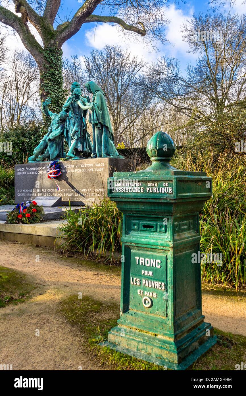 Public collection box for the poor of Paris and the memorial tomb to fallen Czech soldiers in the Père Lachaise Cemetery, Paris 75020, France. Stock Photo
