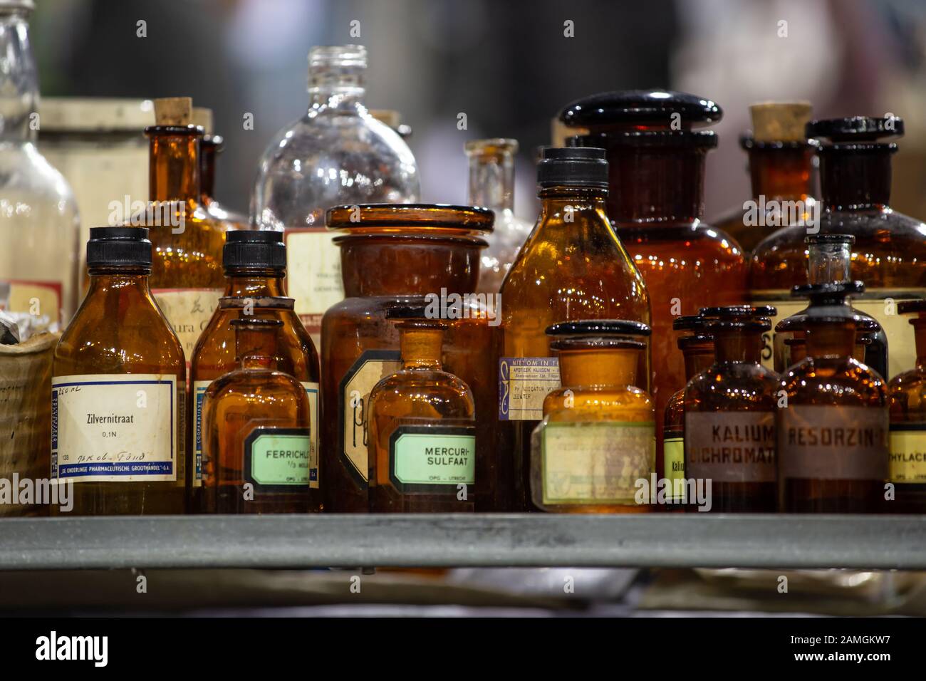 Arnhem, Netherlands, January 2020: Collection of vintage pharmacy bottles made of brown glass and with Dutch labels Stock Photo