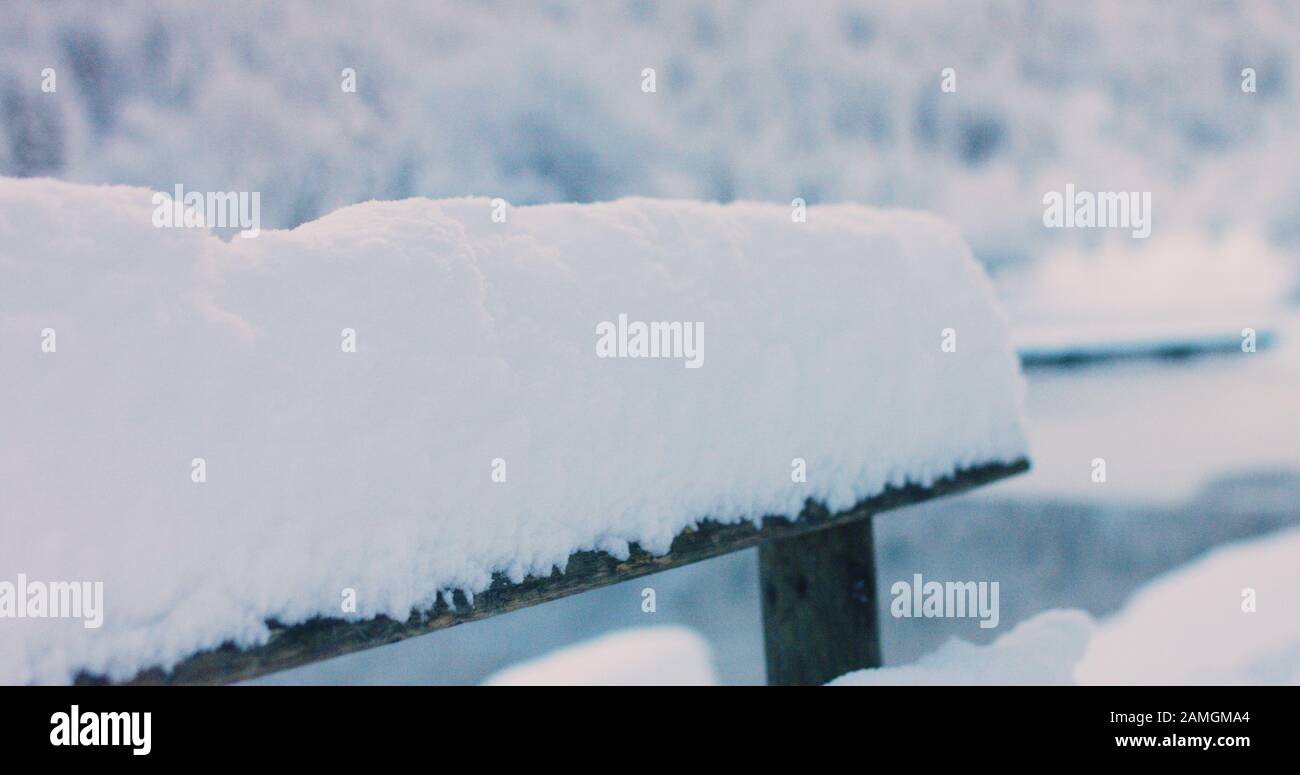 Wooden fence covered with fresh snow in winter Stock Photo - Alamy