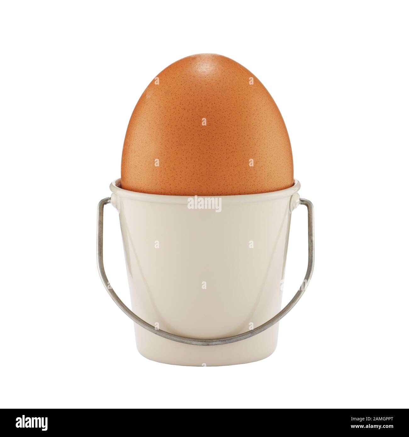 An egg in a bucket shaped eggcup on white with clipping path Stock Photo