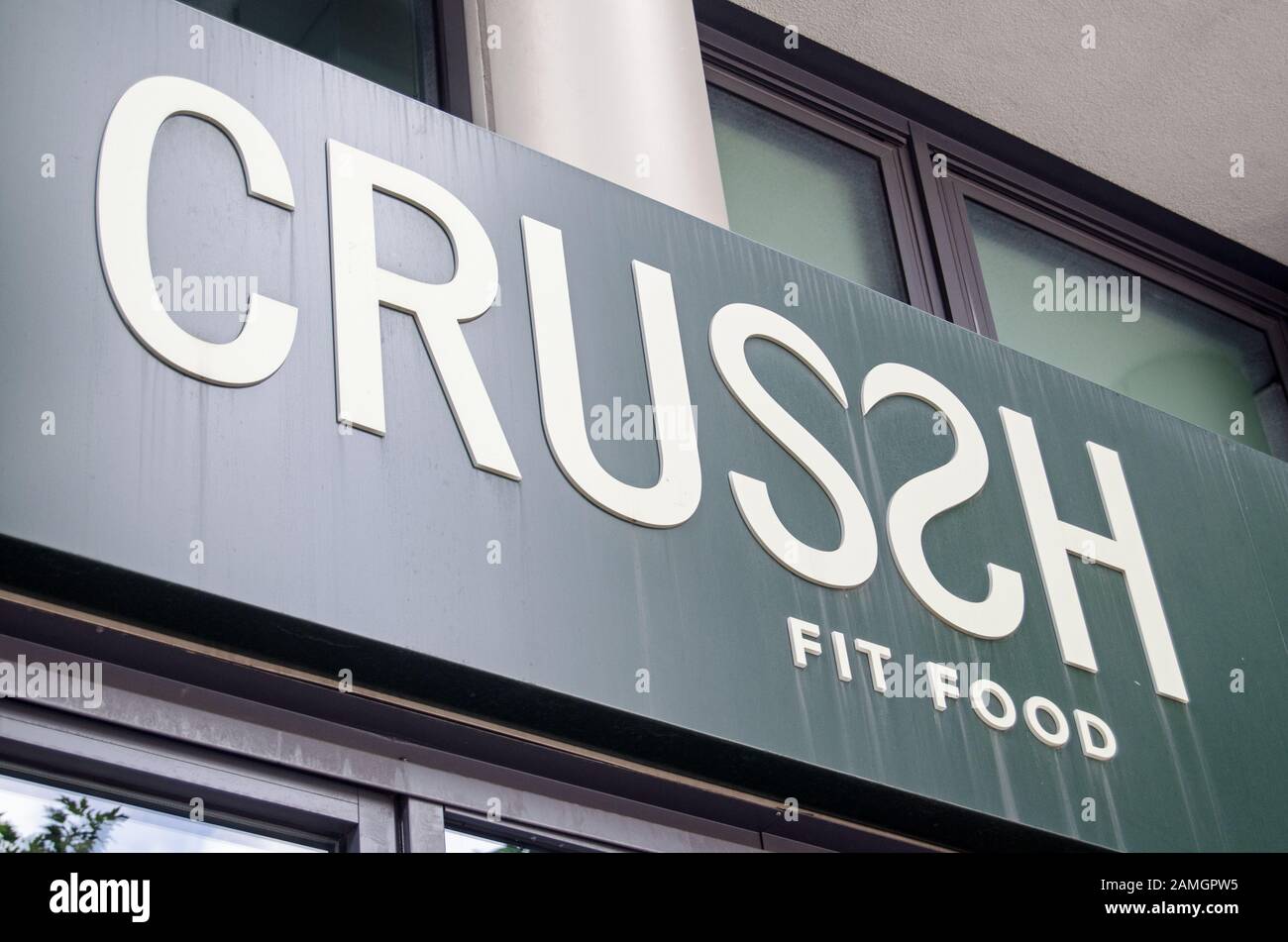 London, UK - July 20, 2019: Sign above the entrance to  Crussh fast food shop.  The retailer specialises in selling healthy fast food, smoothies and s Stock Photo