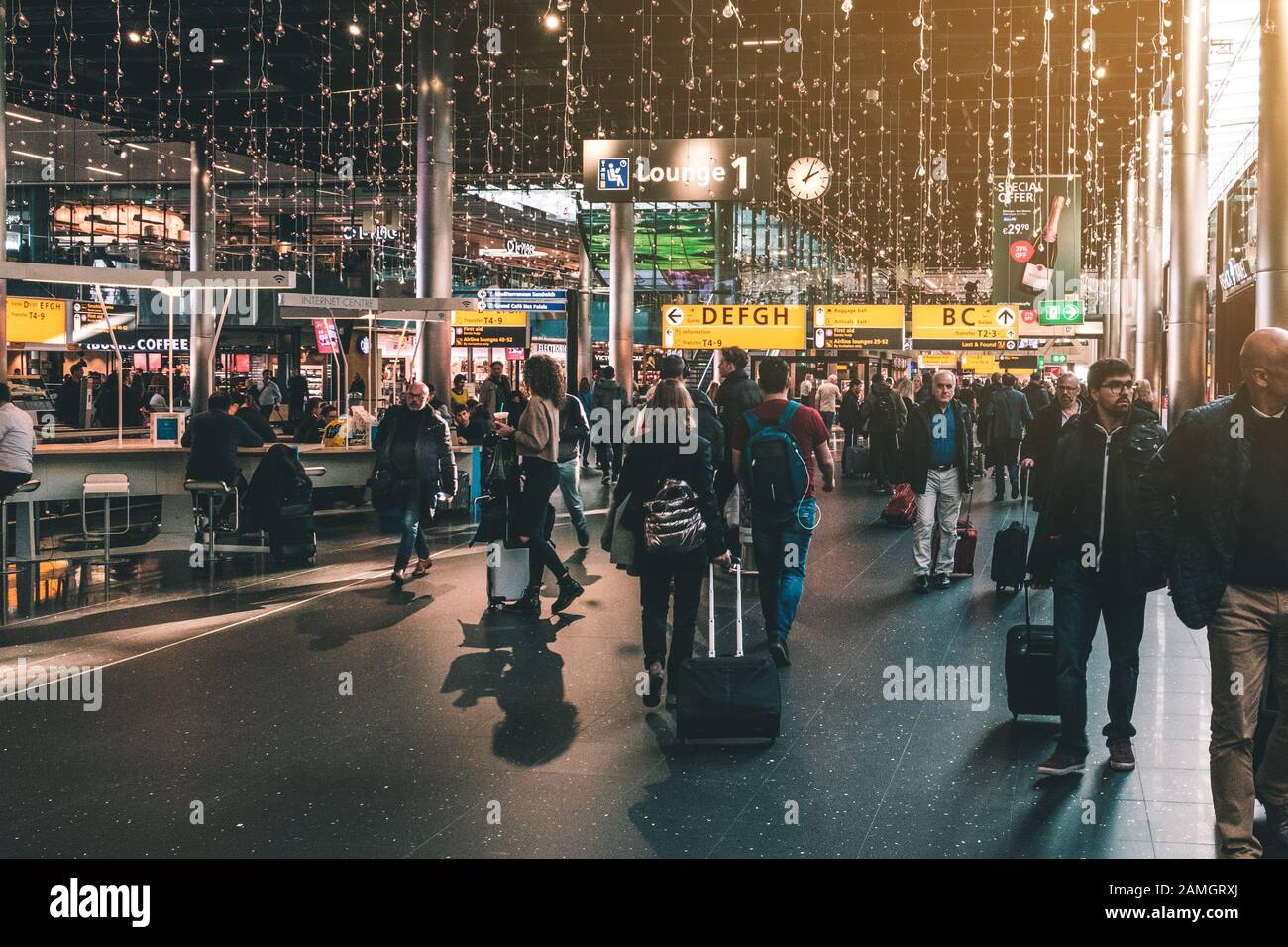 Amsterdam, Netherlands - November, 2019: People on airport (Schipol airport) in Amsterdam Stock Photo