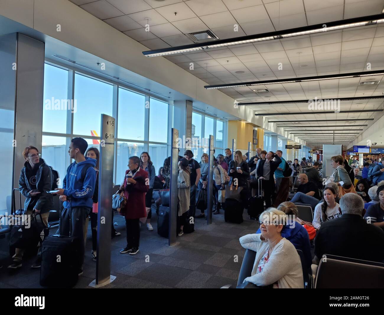 People line up based on boarding group numbers to board a Southwest Airlines flight at Oakland International Airport (OAK) in Oakland, California, January 5, 2020. () Stock Photo
