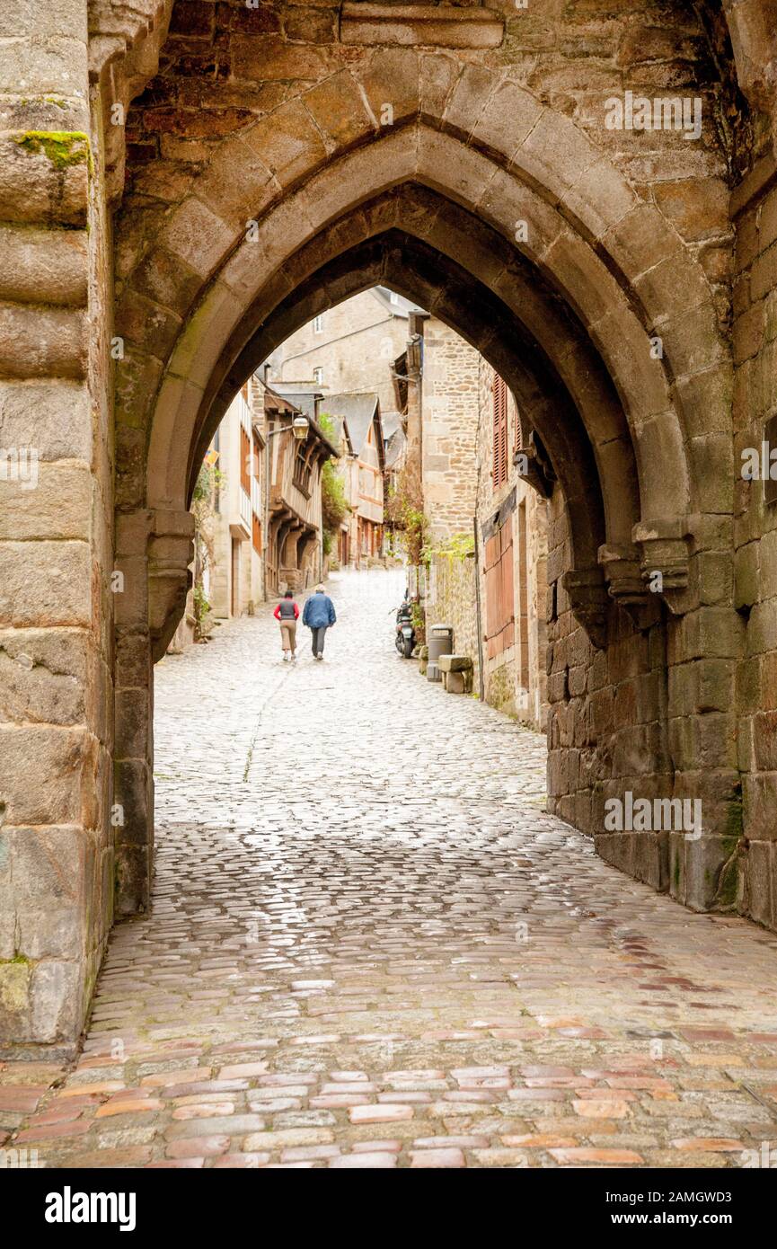 Old gates Porte du Jerzual in city wall and cobblestone Rue du Jerzual