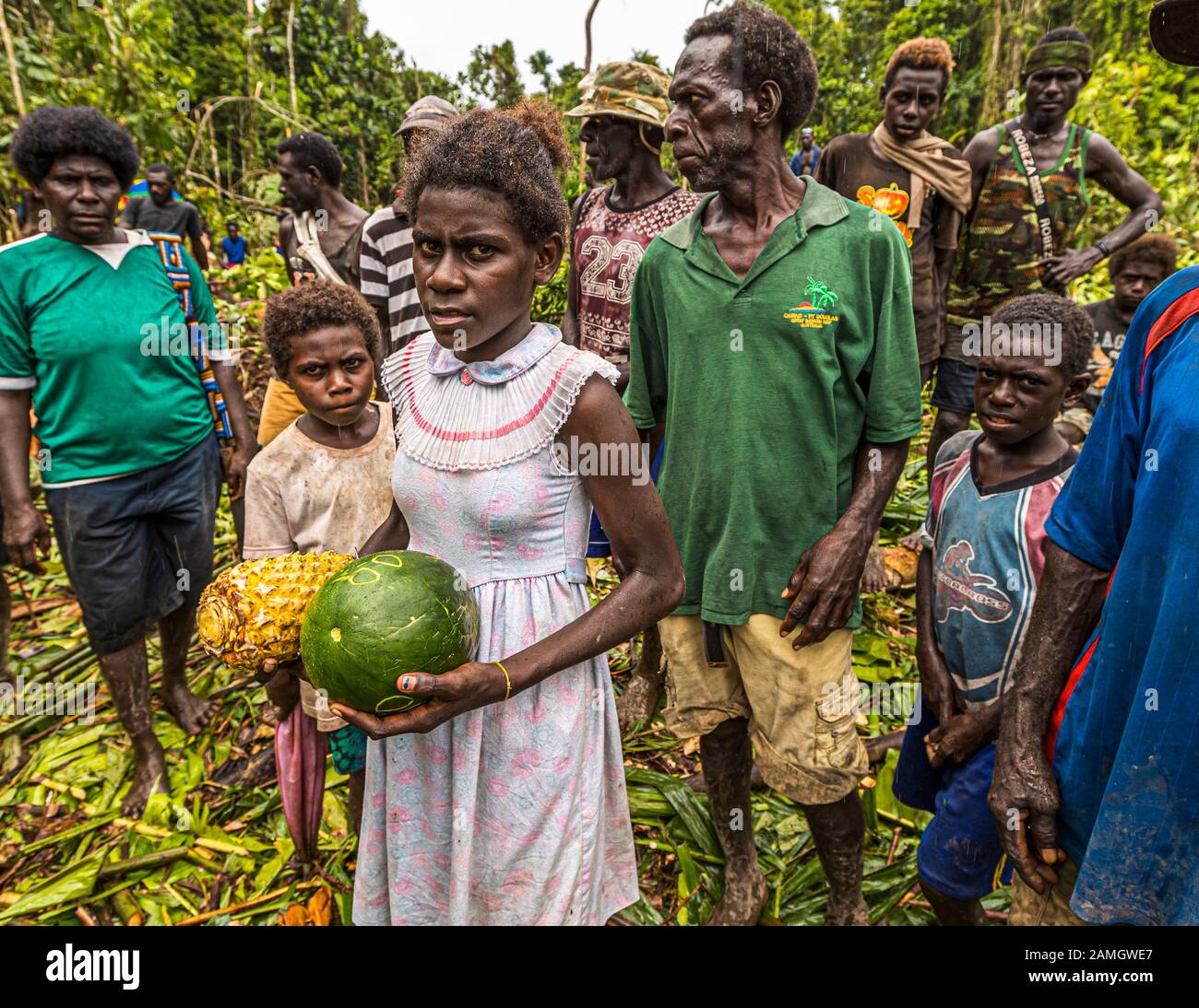 People in Bougainville Jungle offering Fruits, Papua New Guinea Stock