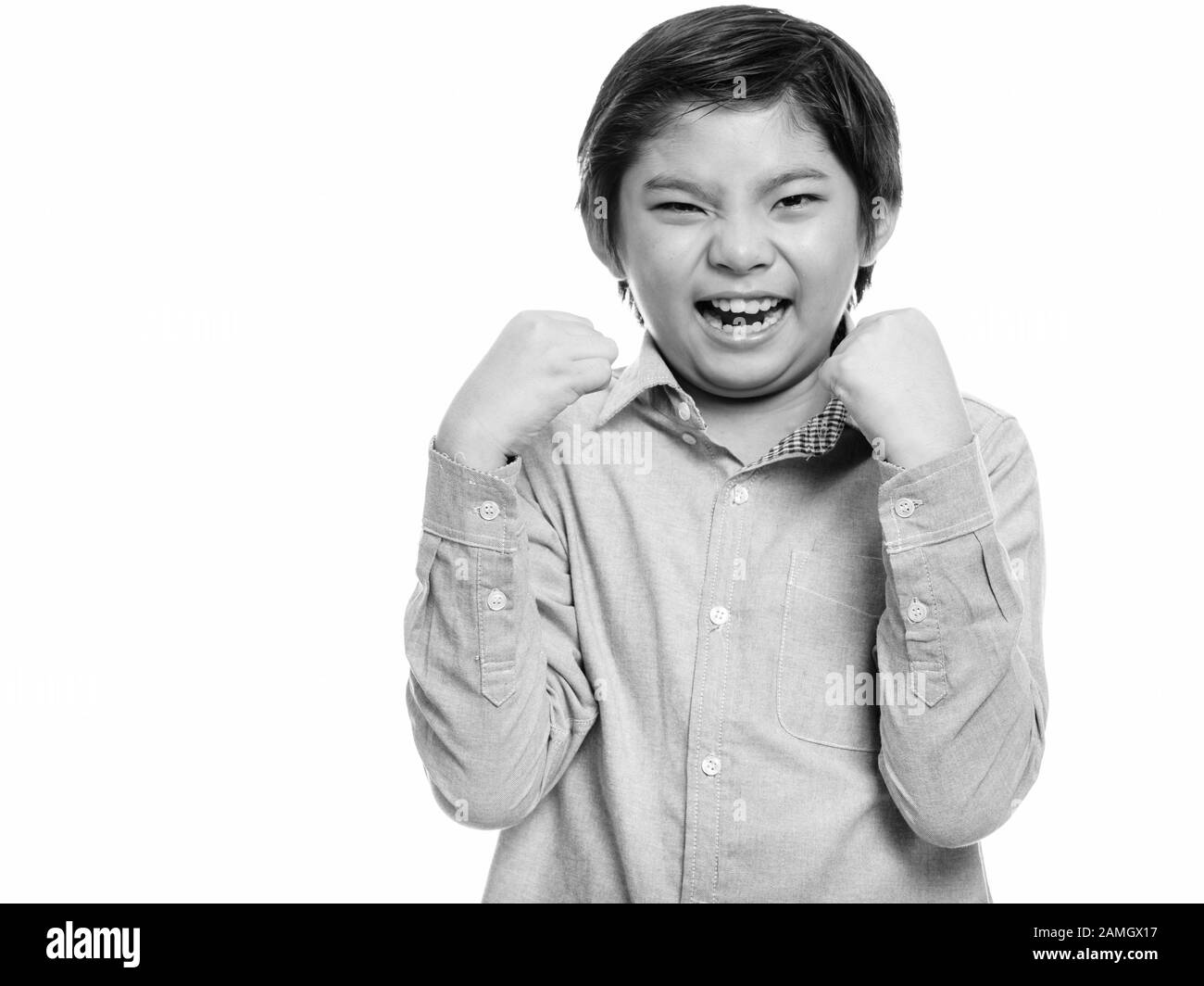 Studio shot of happy cute Japanese boy smiling and looking excited Stock  Photo - Alamy