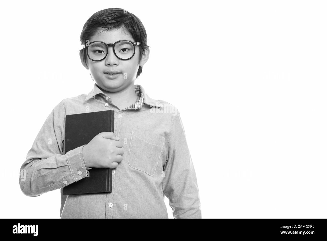 Asian boy is holding book Black and White Stock Photos & Images - Alamy