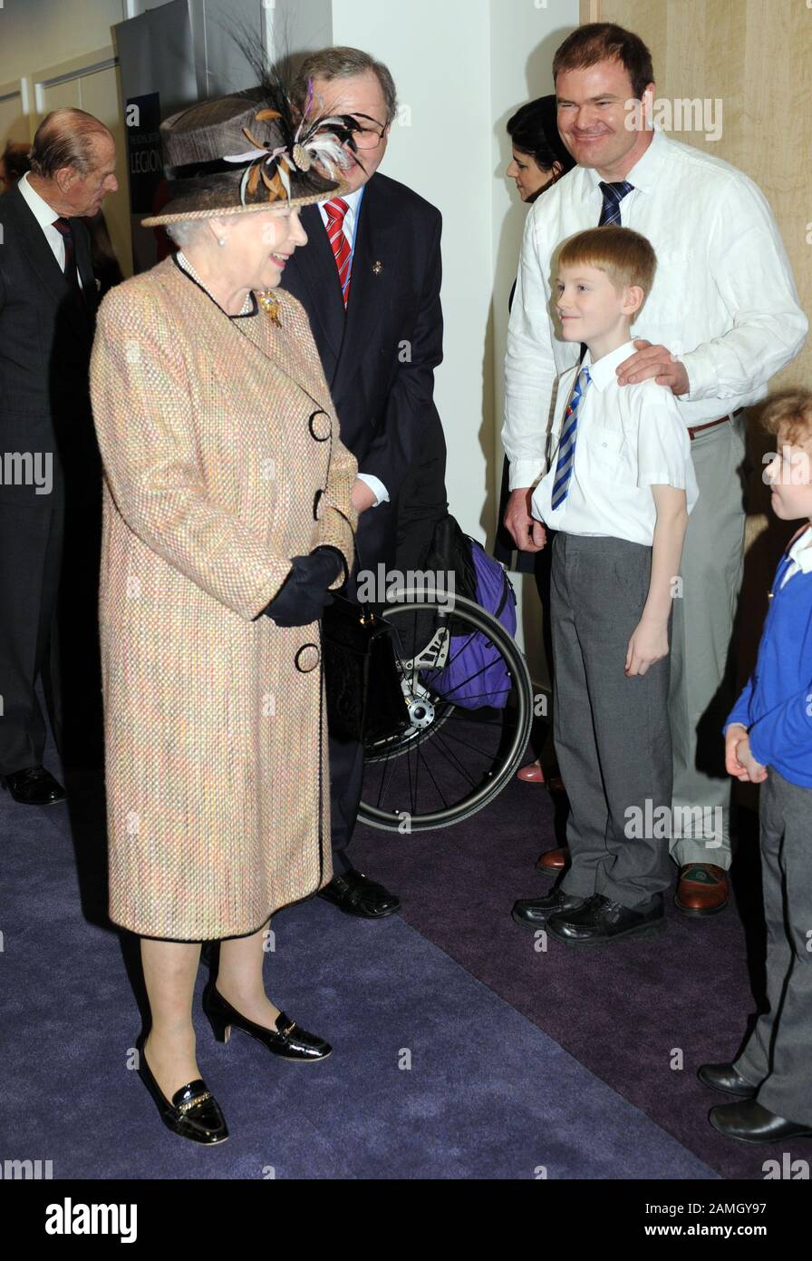 9 year old George Taylor official club campaigner for the British legion  meeting  the H.M. The Queen at the opening of the new British legion in 2009. Stock Photo