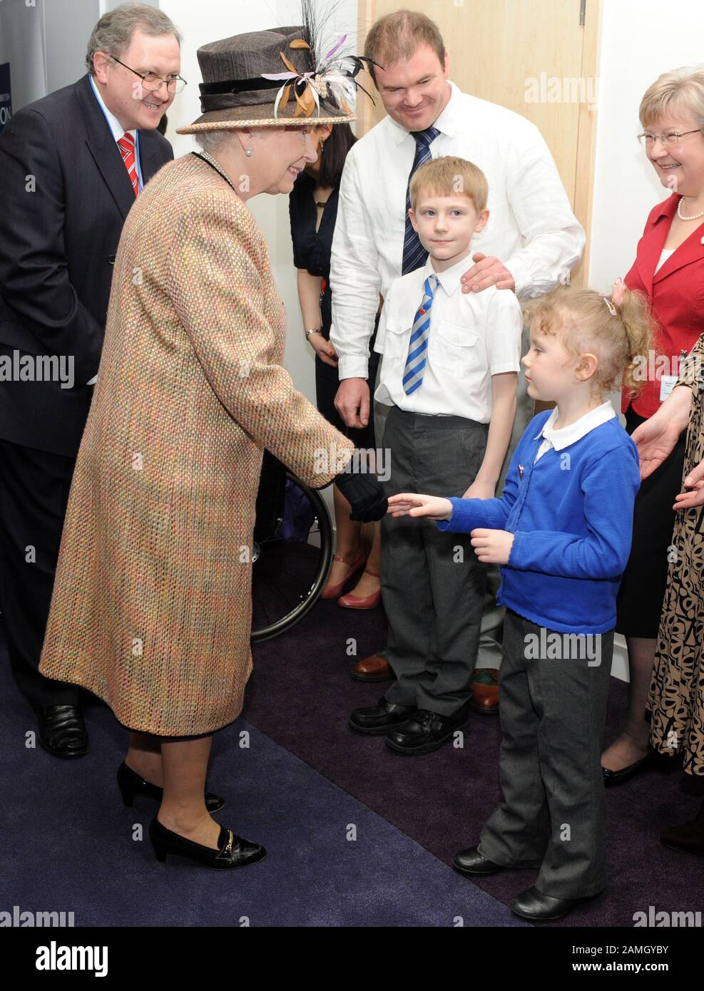 9 year old George Taylor official club campaigner for the British legion  meeting  the H.M. The Queen at the opening of the new British legion in 2009. Stock Photo