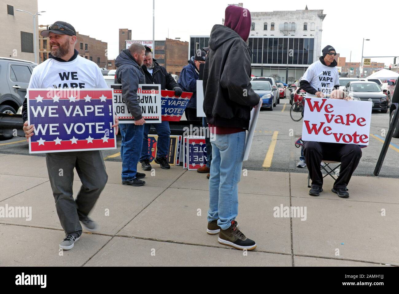 Pro-vape demonstrators stand outside with signs stating 'we vape we vote' rally in Toledo, Ohio during a visit from President Trump. Stock Photo