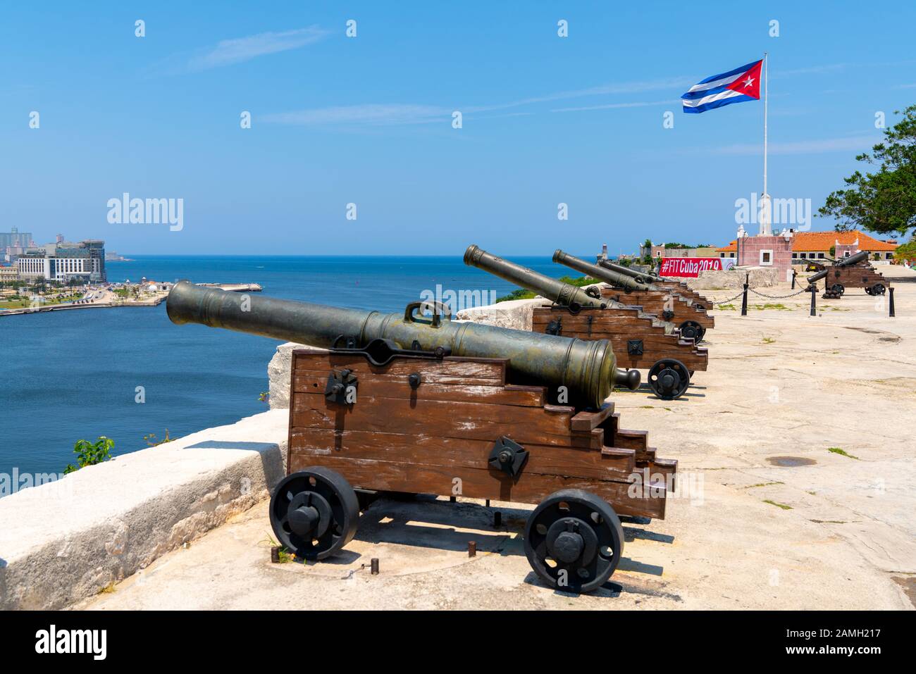 Cuba, Havana. Fortress wall and Cuban flag at San Carlos de