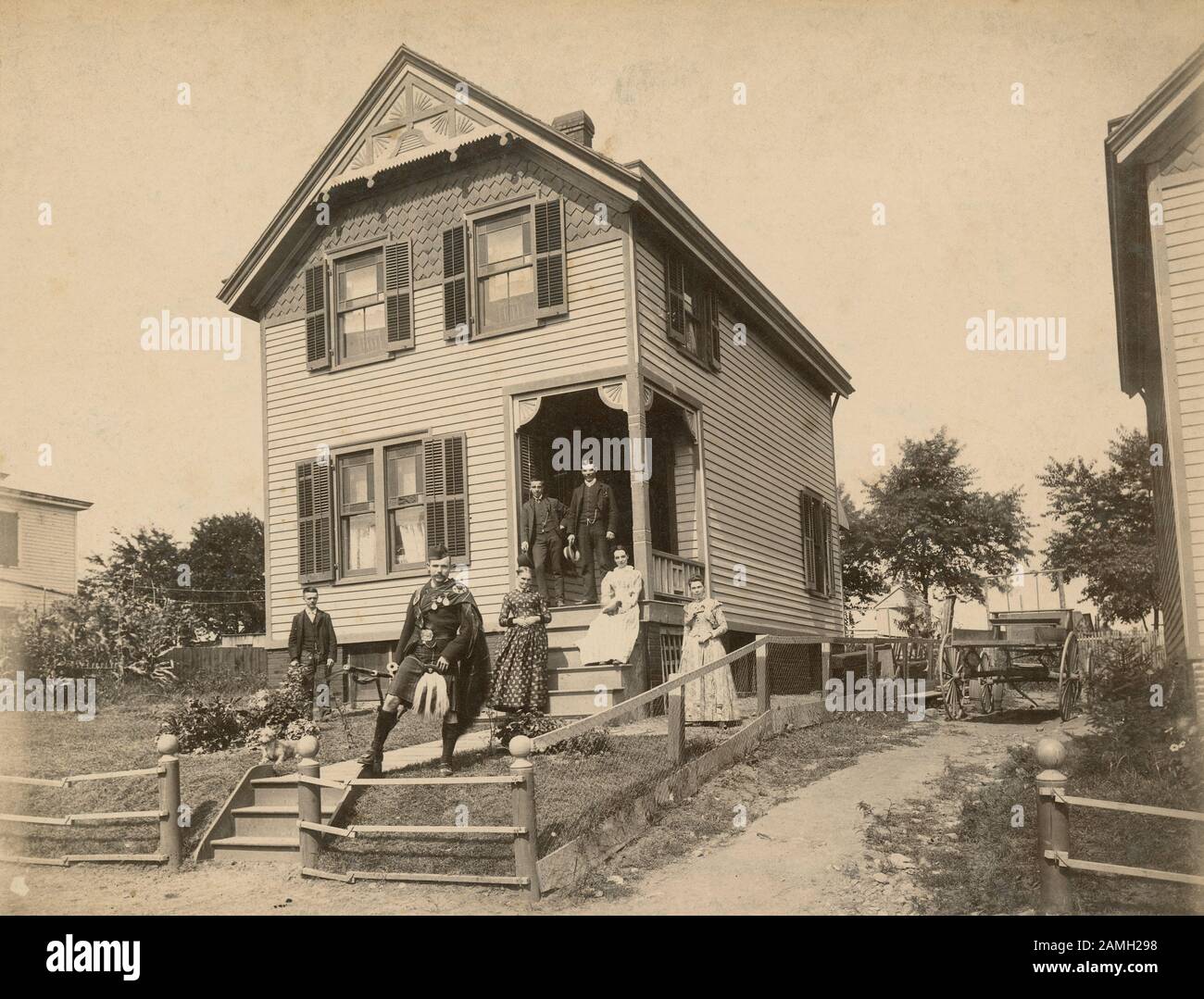 Antique c1890 photograph, “home of a Scotch family in Garfield, New Jersey; the young man in Highland Scotch costume.” SOURCE: ORIGINAL PHOTOGRAPH Stock Photo