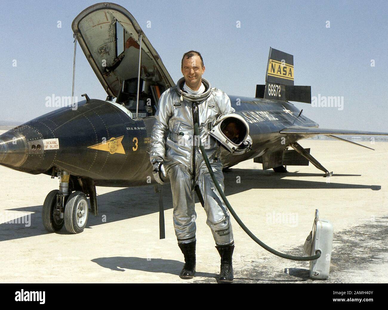Photograph of NASA research pilot Bill Dana standing next to the the North American X15, a