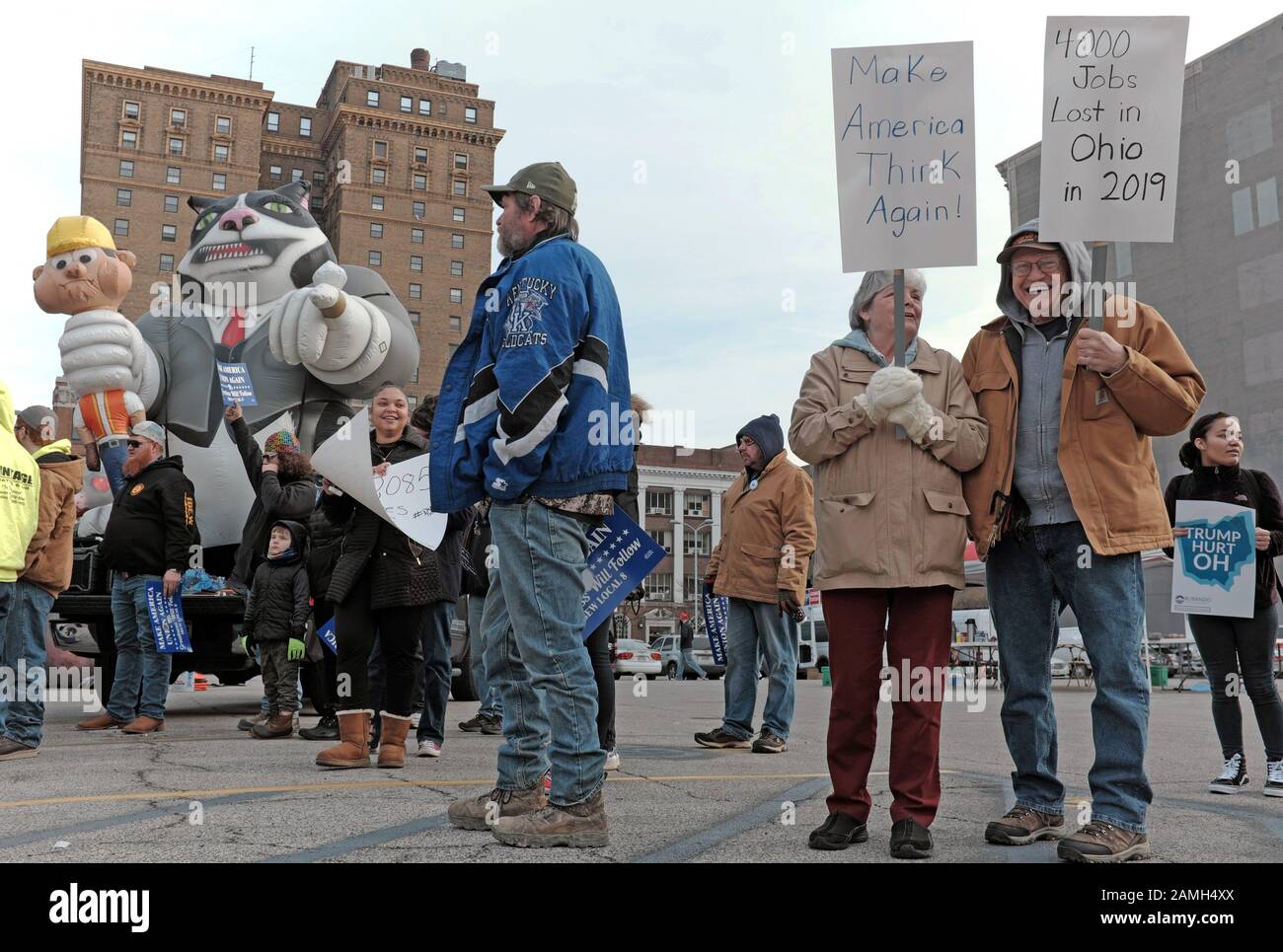 2019 job losses in Ohio on a sign is one area of protest by residents greeting President Trump during his January 9, 2020 campaign stop in Toledo, Ohio, USA. Well outnumbered by Trump supporters attending the nearby 2020 Trump Reelection Rally, protesters still made their voices heard throughout the downtown area near the convention center where Trump and Pence were holding their rally. Stock Photo